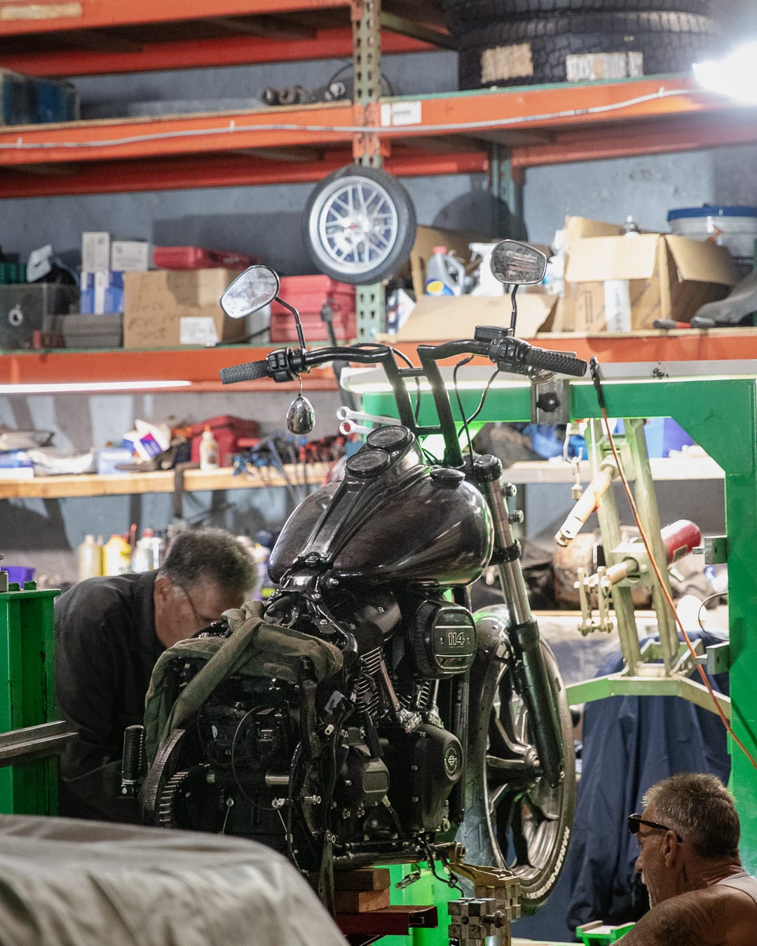 Technician working on a Harley-Davidson frame in the shop